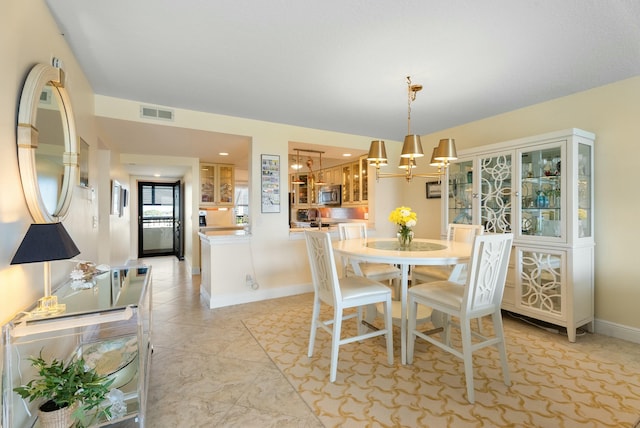 dining area featuring a chandelier