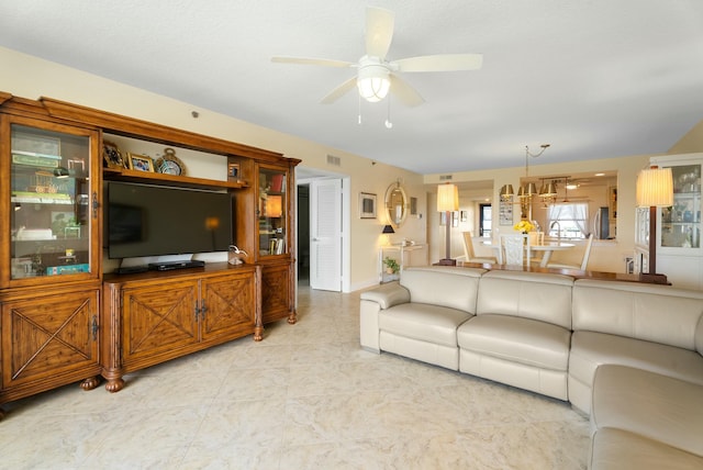 living room featuring ceiling fan