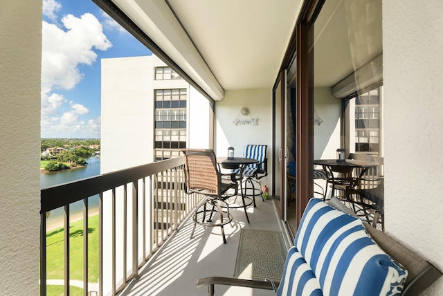 balcony featuring a water view