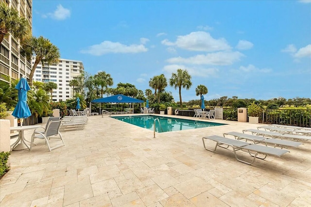 view of swimming pool with a patio area