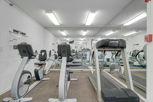 exercise room with a textured ceiling