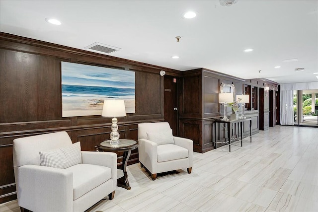 living area with wooden walls