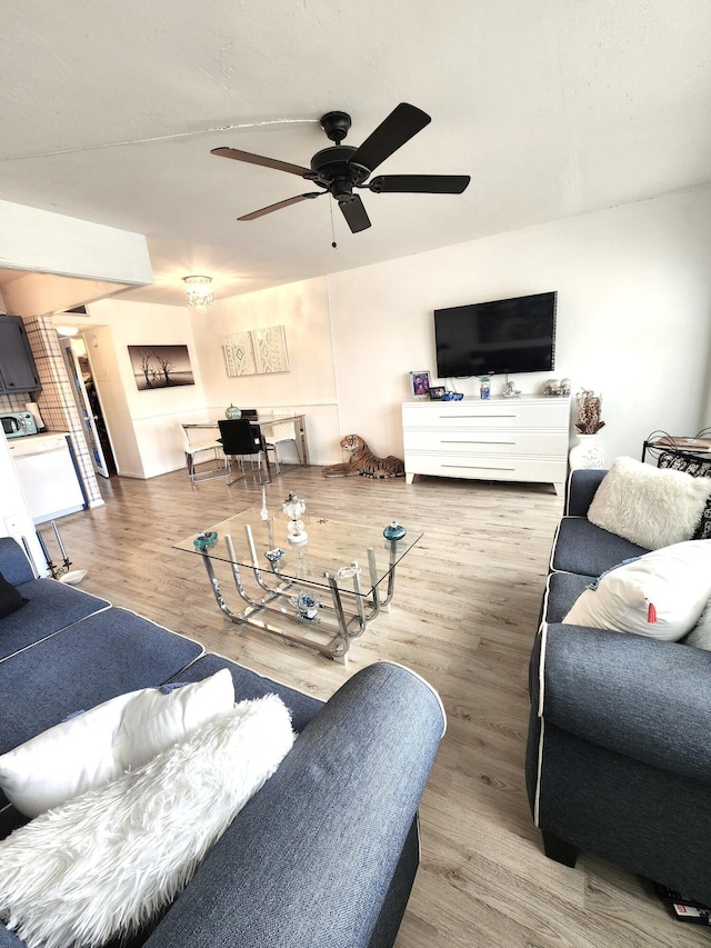 living room featuring ceiling fan and wood finished floors