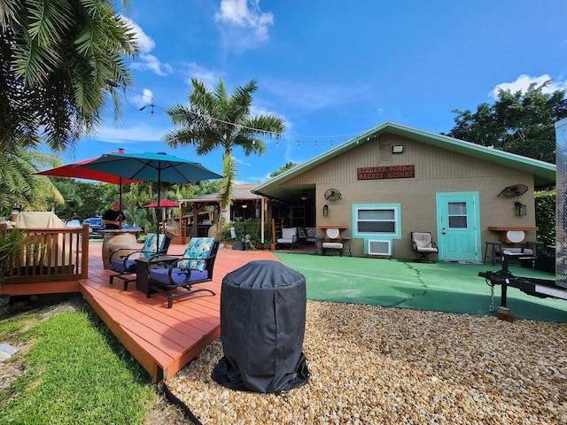 rear view of house featuring a deck