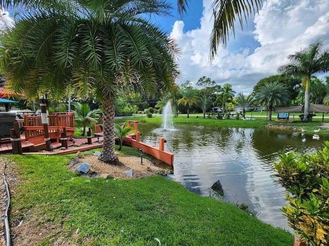 surrounding community featuring a water view