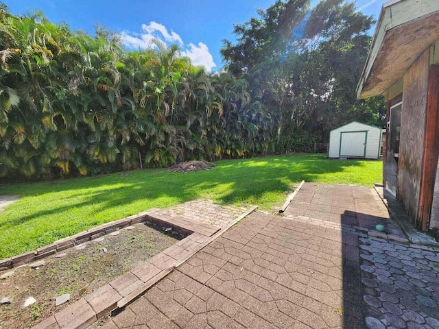 view of patio / terrace featuring a storage unit