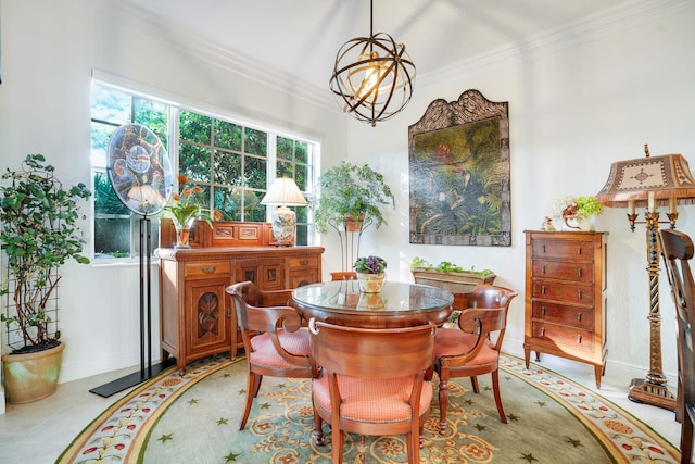 dining room with crown molding and an inviting chandelier