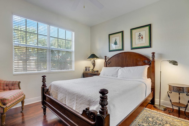 bedroom featuring ceiling fan and dark hardwood / wood-style floors