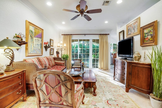 living room featuring crown molding and ceiling fan