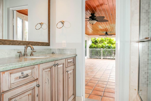 bathroom featuring vanity, tile patterned flooring, plenty of natural light, and wooden ceiling