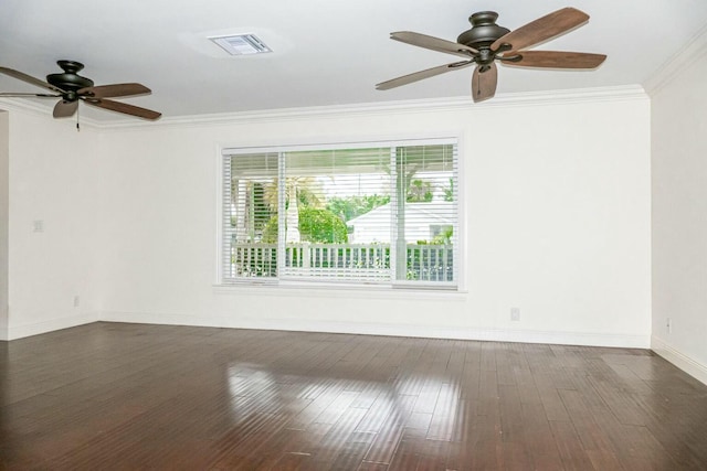 empty room featuring crown molding, ceiling fan, and dark wood-type flooring