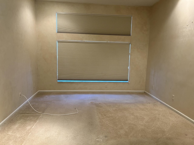 empty room with light colored carpet