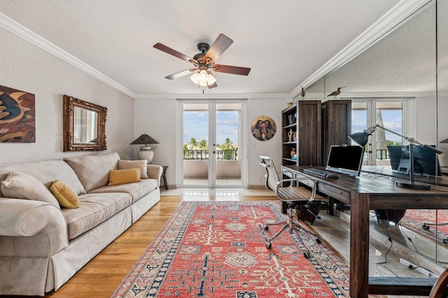 office space with wood-type flooring, plenty of natural light, crown molding, and french doors