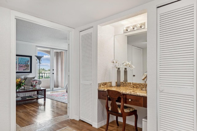 bathroom with vanity and hardwood / wood-style flooring