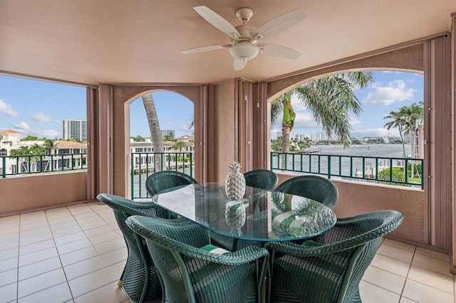 sunroom / solarium with ceiling fan