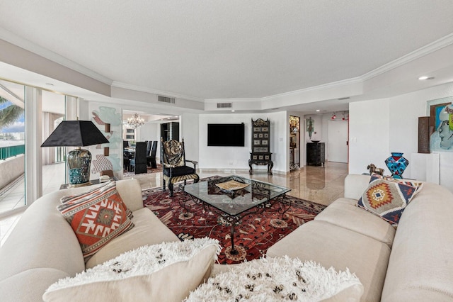 living room featuring an inviting chandelier, crown molding, and a textured ceiling