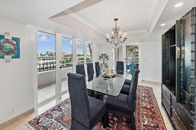 dining area featuring light tile patterned flooring, crown molding, a chandelier, a textured ceiling, and a raised ceiling