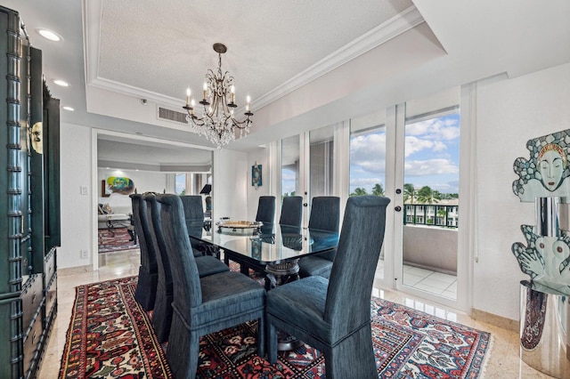 dining room with a notable chandelier, crown molding, a raised ceiling, and a textured ceiling