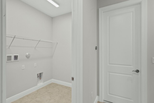 laundry room featuring hookup for a gas dryer, electric dryer hookup, hookup for a washing machine, and light tile patterned floors