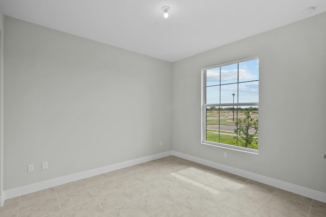 tiled spare room with a wealth of natural light