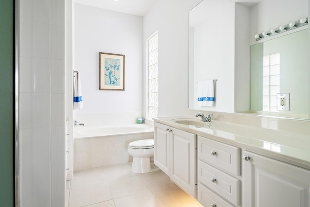 bathroom with tile patterned flooring, a garden tub, vanity, and toilet