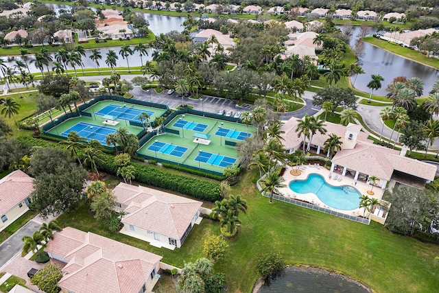 birds eye view of property with a water view and a residential view