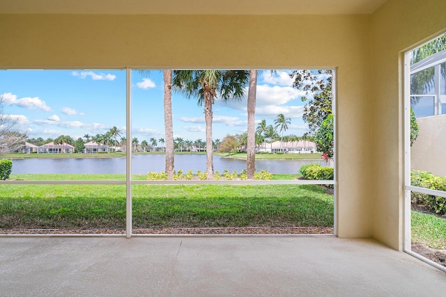 unfurnished sunroom with a water view