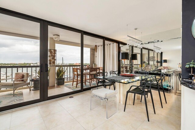 tiled dining area with a wall of windows and plenty of natural light