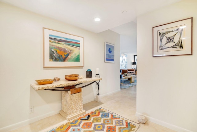 hall featuring light tile patterned floors