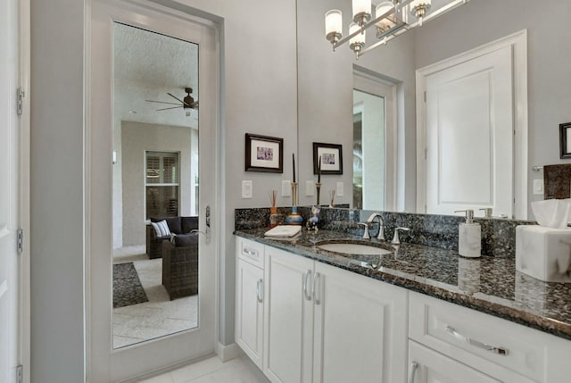 bathroom featuring vanity and ceiling fan