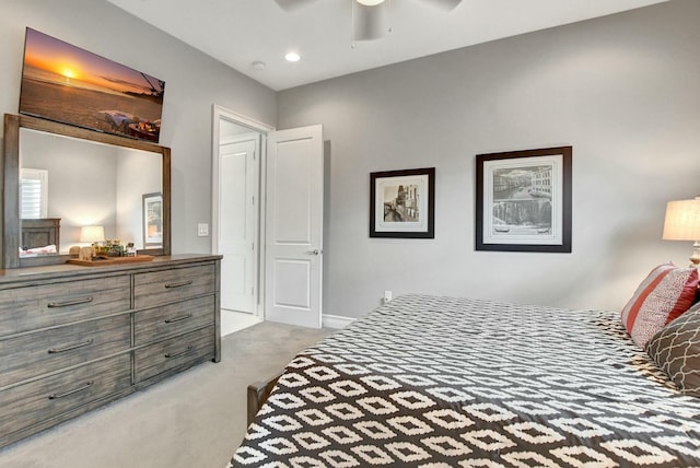 bedroom featuring ceiling fan and carpet