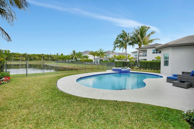 view of swimming pool featuring a yard, a patio area, an in ground hot tub, and a water view