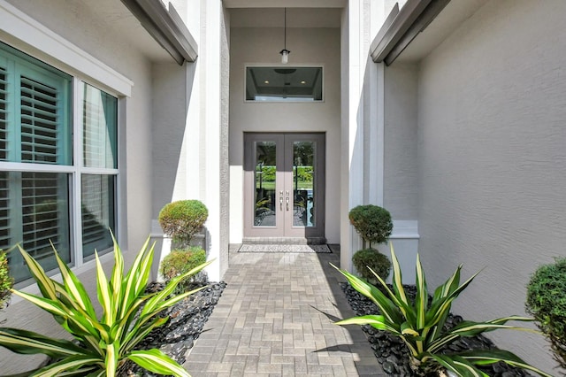 view of exterior entry featuring french doors