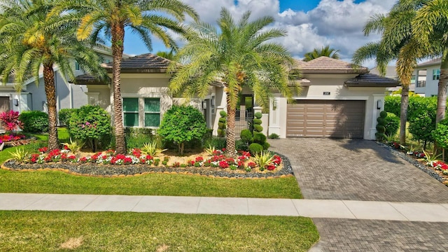 mediterranean / spanish-style house featuring a garage