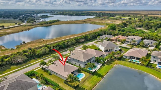 drone / aerial view featuring a water view