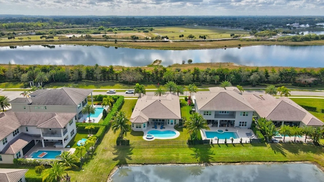 drone / aerial view with a water view