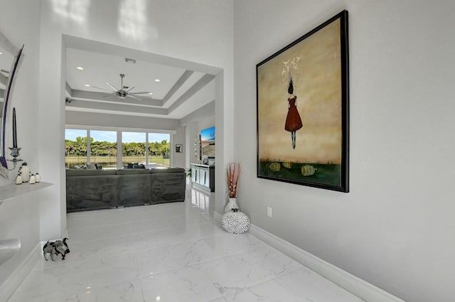 corridor with a tray ceiling