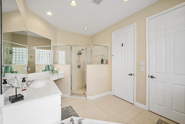 bathroom featuring recessed lighting, a stall shower, vanity, and tile patterned flooring