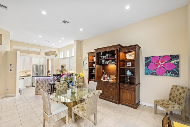 dining space featuring light tile patterned flooring, visible vents, recessed lighting, and baseboards