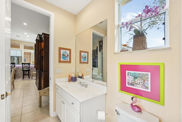 bathroom with vanity, tile patterned floors, toilet, and recessed lighting