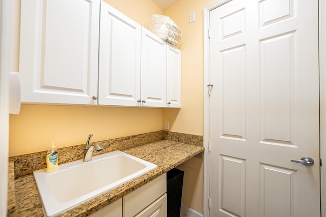 laundry area with a sink