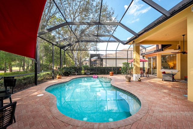 pool featuring a lanai and a patio area