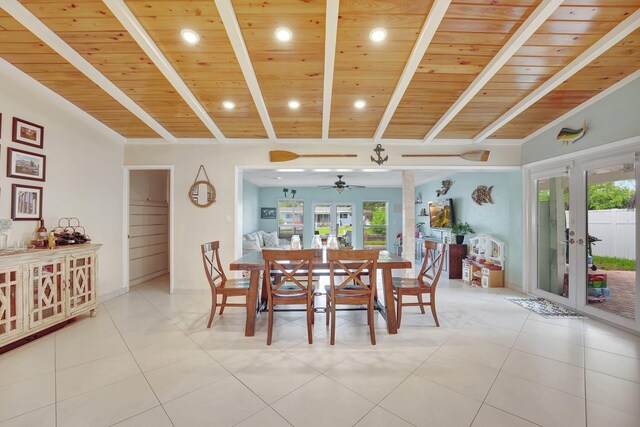 dining space with french doors, a healthy amount of sunlight, wooden ceiling, and vaulted ceiling with beams