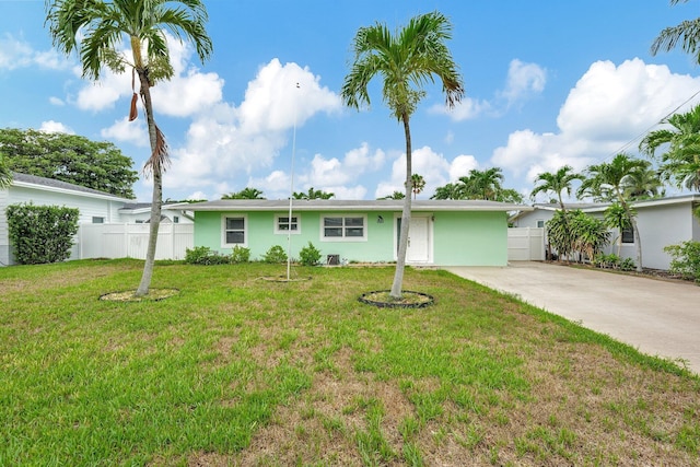 ranch-style house with a front lawn
