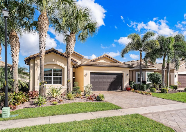 mediterranean / spanish-style home featuring a garage