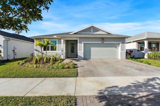 ranch-style house featuring a garage