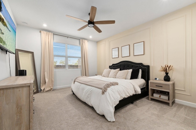 bedroom featuring ceiling fan and light colored carpet