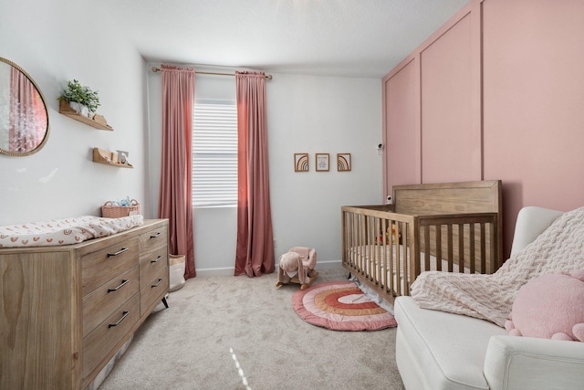 carpeted bedroom with a crib