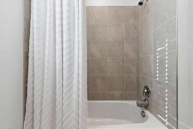 bathroom with shower / bath combo