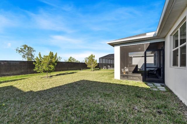 view of yard featuring a sunroom